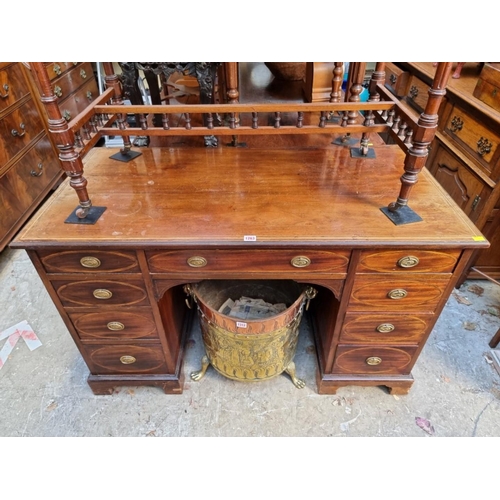 1263 - A circa 1900 mahogany and inlaid pedestal desk, 121.5cm wide. 