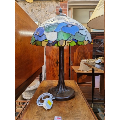 1267 - A Tiffany style stained glass table lamp, 58cm high. 