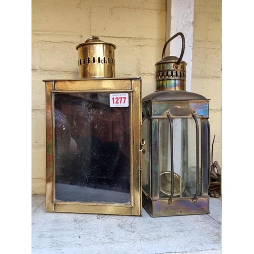 1277 - An old brass triangular lantern, 33cm high; together with another brass lantern; and a copper burner... 