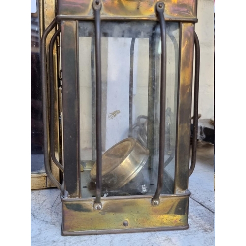 1277 - An old brass triangular lantern, 33cm high; together with another brass lantern; and a copper burner... 