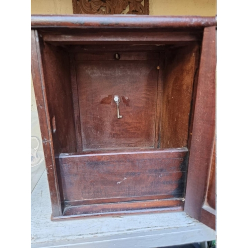 1289 - An antique mahogany wall mounted post box, 27cm wide; together with a Balinese carved wood panel.... 