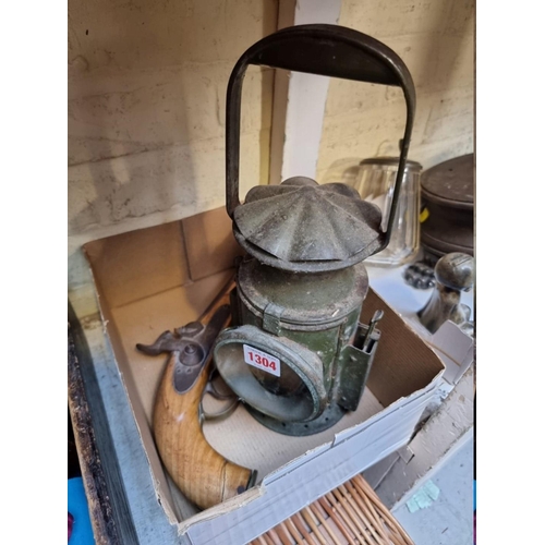 1304 - A 1950s green painted signalling lantern, inscribed 'C E & S' and with broad arrow stamp, 33.5cm... 