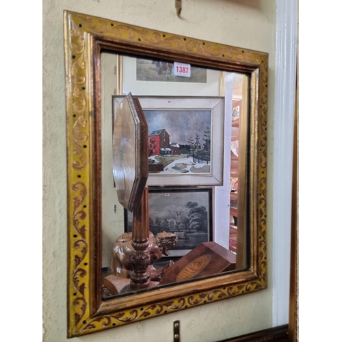 1387 - A gilt framed rectangular wall mirror, 49 x 39cm.