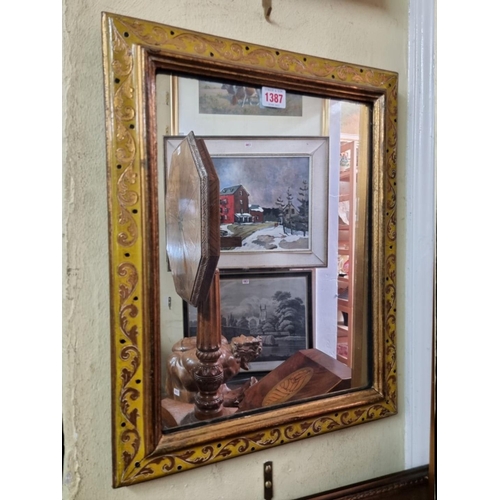 1387 - A gilt framed rectangular wall mirror, 49 x 39cm.