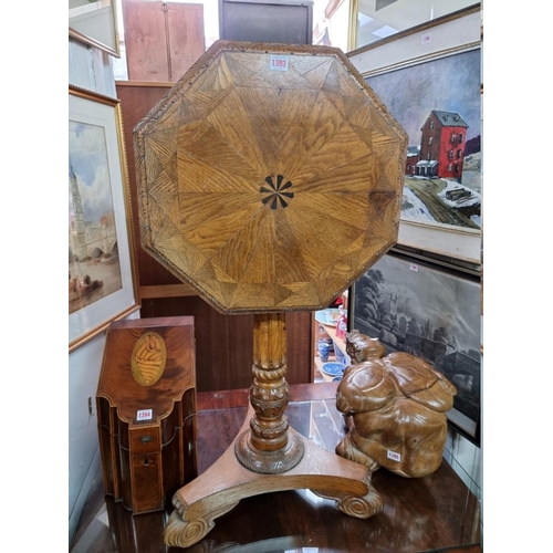 1393 - An interesting Victorian carved oak octagonal pedestal table, with parquetry tilt top and fluted col... 