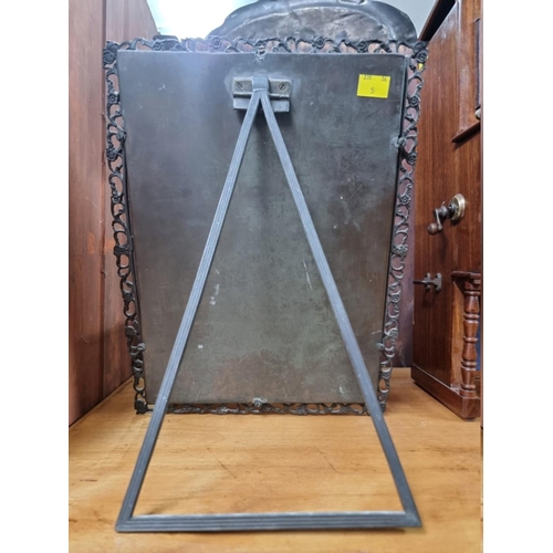 1415 - An old cast brass easel back mirror, with pierced decoration, 37 x 29cm. 