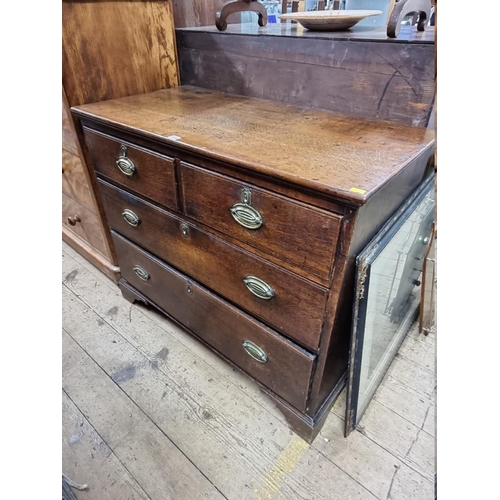 1418 - A George III oak chest of drawers, 105cm wide.