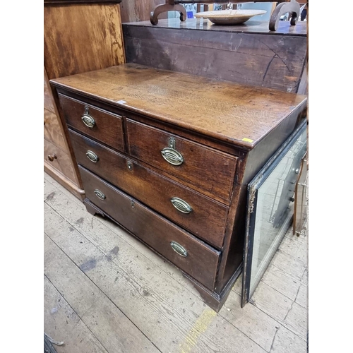 1418 - A George III oak chest of drawers, 105cm wide.