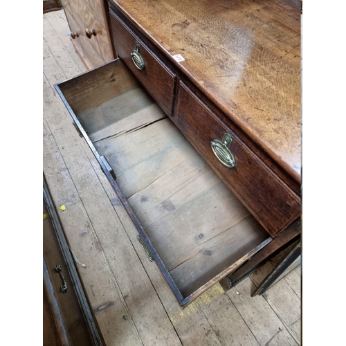 1418 - A George III oak chest of drawers, 105cm wide.