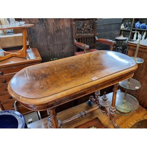 1455 - A Victorian figured walnut oval card table, 92cm wide. 