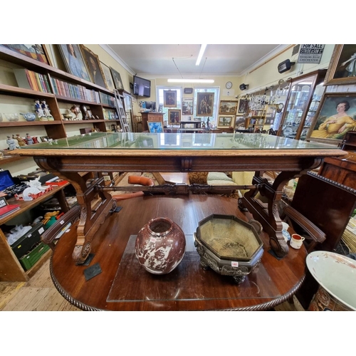 1457 - An interesting Victorian carved oak library table, in the manner of J G Crace, with a pair of concea... 