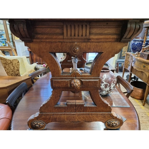 1457 - An interesting Victorian carved oak library table, in the manner of J G Crace, with a pair of concea... 