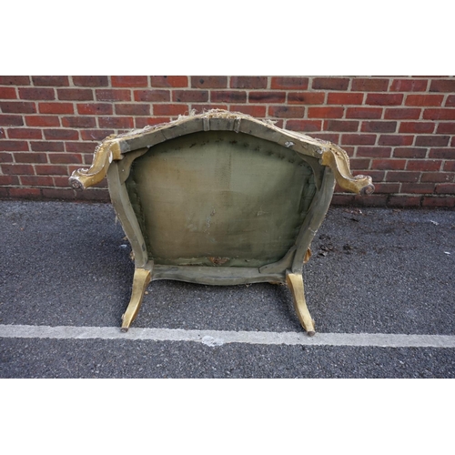 1469 - (ML) A late 19th century, Louis XV style, giltwood and upholstered wing armchair, with relief carved... 