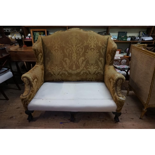 1471 - (ML) An antique wing back two seater settee, on claw and ball feet to the front.Provenance: The Nash... 