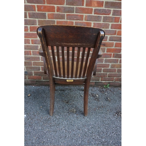 1474 - (ML) An unusual 1920s oak desk chair, labelled 'The Globe-Wernicke Co Ltd', (repaired). ... 