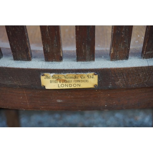 1474 - (ML) An unusual 1920s oak desk chair, labelled 'The Globe-Wernicke Co Ltd', (repaired). ... 