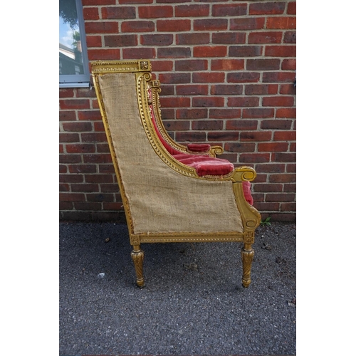 1476 - (ML) A Louis XVI style giltwood wing armchair.