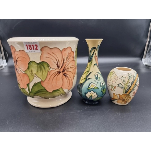 1512 - Three Moorcroft items, comprising: a jardiniere, 17.5cm high, (crazed); a baluster vase, 17cm high, ... 