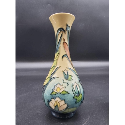 1512 - Three Moorcroft items, comprising: a jardiniere, 17.5cm high, (crazed); a baluster vase, 17cm high, ... 