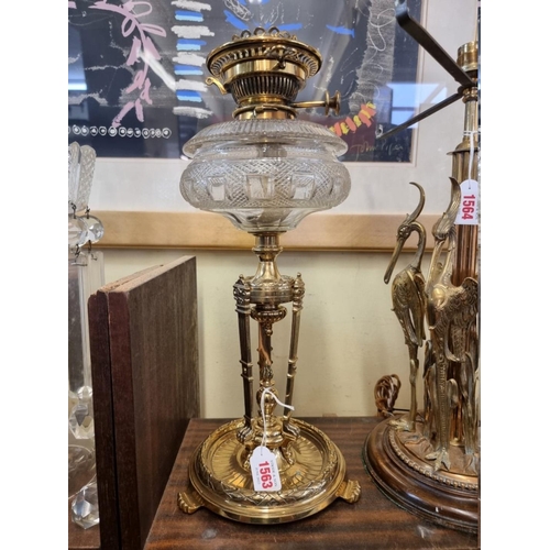 1563 - A good antique brass and cut glass oil lamp, 45cm high.