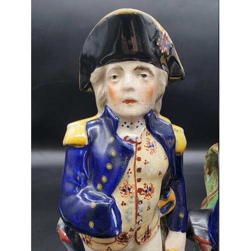 1581 - Two Victorian Staffordshire pottery Horatio Nelson commemorative jugs, largest 30cm high. ... 