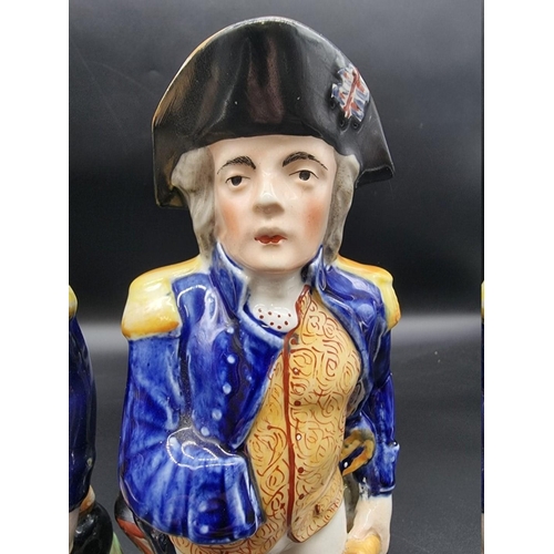 1581 - Two Victorian Staffordshire pottery Horatio Nelson commemorative jugs, largest 30cm high. ... 