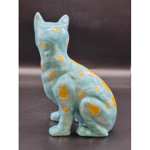 1602 - (ML) A Mosanic pottery cat, painted with yellow hearts on a turquoise ground, 31cm high.... 