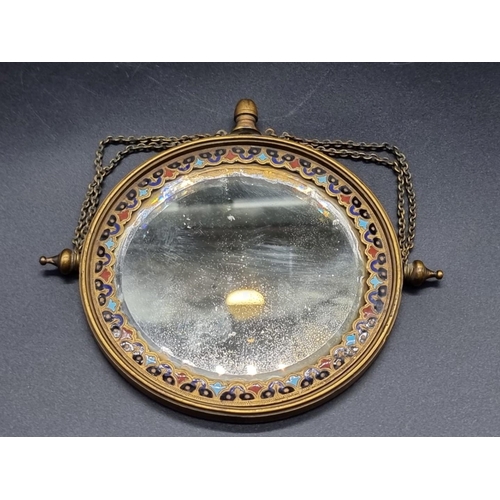 1648 - A continental gilt brass and champleve enamel circular mirror, 13.5cm diameter.