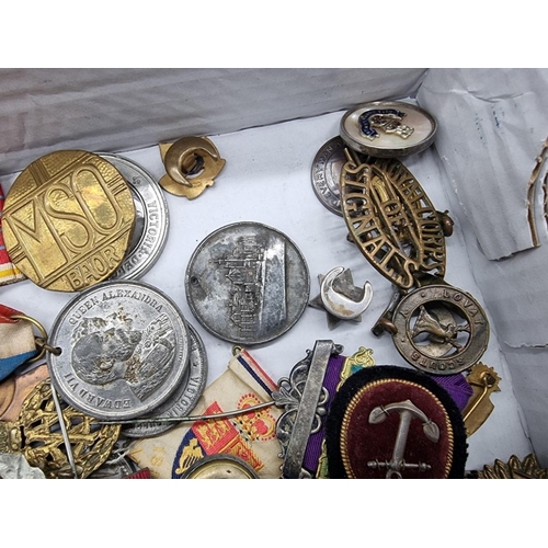 1653 - A collection of various badges and medals.