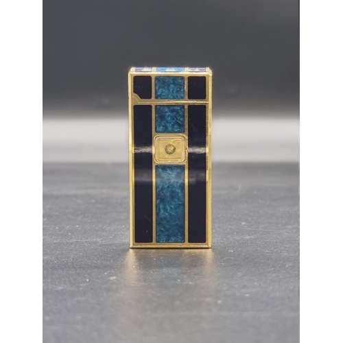 1662 - A vintage Colibri gilt metal and blue lacquer lighter, 6.5cm high.