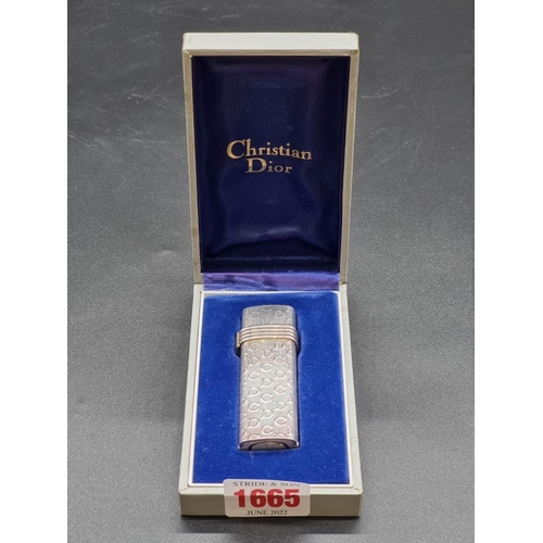 1665 - A Christian Dior lighter, in fitted box.