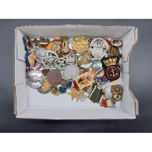 1653 - A collection of various badges and medals.