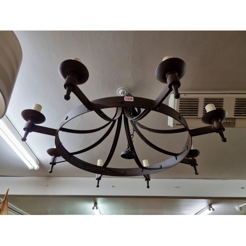 1439 - A steel eight branch ceiling light, 73cm diameter.