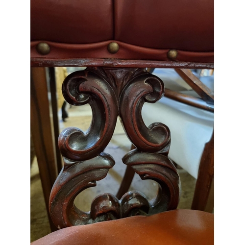 1464 - A Victorian carved mahogany and upholstered desk chair.