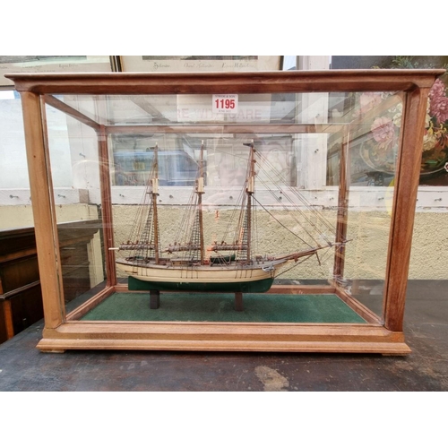 1174 - A model of a clipper, in a glazed case, 35cm high x 50cm wide.