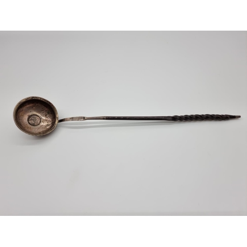 582 - A Georgian silver and baleen toddy ladle, with coin inset bowl, 34.5cm.... 