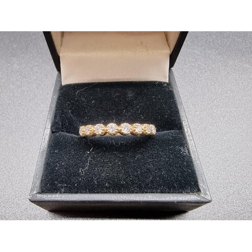 698 - A yellow metal diamond half eternity ring, stamped 14k, size N.