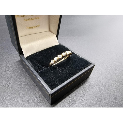 698 - A yellow metal diamond half eternity ring, stamped 14k, size N.