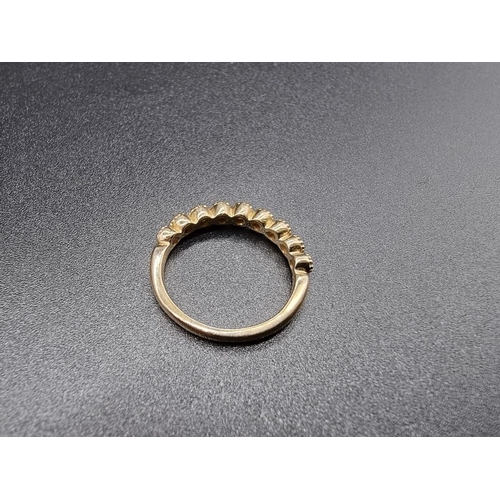 698 - A yellow metal diamond half eternity ring, stamped 14k, size N.