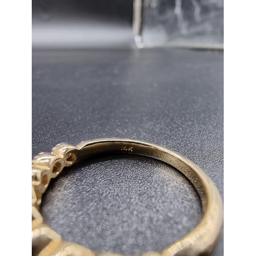 698 - A yellow metal diamond half eternity ring, stamped 14k, size N.