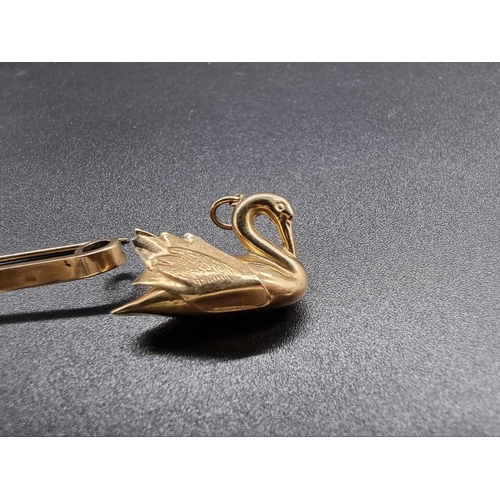 717 - A 9ct gold tie pin decorated pendant swan, by G&P, Birmingham 1929, 6cm; together with a similar... 