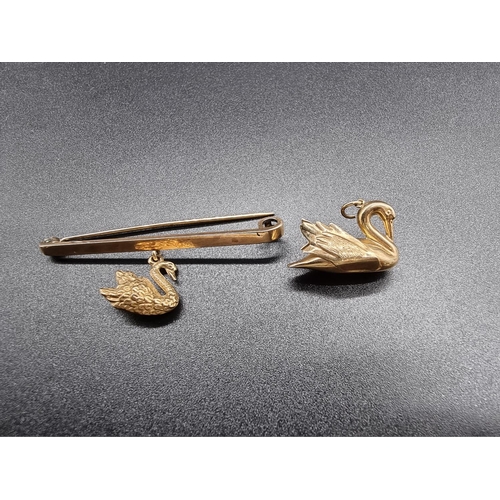 717 - A 9ct gold tie pin decorated pendant swan, by G&P, Birmingham 1929, 6cm; together with a similar... 