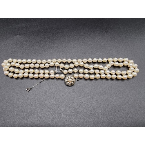 801 - A pearl two strand necklace, having clasp stamped 18k, by GVS, 44cm.