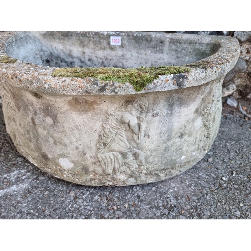 1052 - A reconstituted half moon garden trough, 68cm wide.