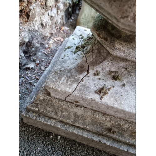 1053 - A reconstituted stone font style pedestal urn, 73cm high.