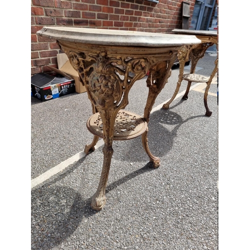 1056 - A cast iron pub table, having wooden top, 58cm wide x 70cm high.