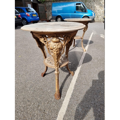 1057 - A cast iron pub table, having wooden top, 58cm wide x 70cm high.