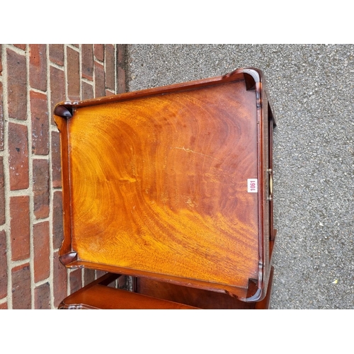 1061 - A pair of reproduction mahogany tray top coffee tables, 51cm wide x 59cm high x 61cm deep. ... 