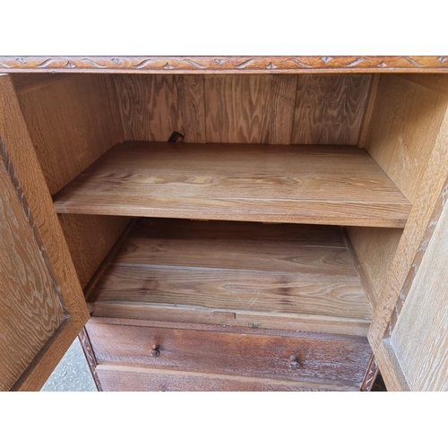 1062 - A Heals limed oak bedroom cupboard, 76cm wide x 130cm high x 47cm deep. 