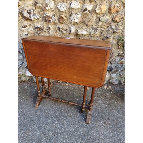 1065 - An Edwardian Sutherland table; together with a walnut piano stool. 